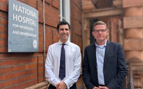 Reece Hibbert (right) alongside Prof. Hani Marcus, the neurosurgeon who led the procedure.
