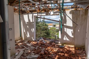 House damaged by Hezbollah projectile.