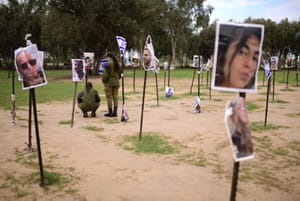 Israeli soldiers visit the site of the Nova music festival massacre, in Re'im, near the Israeli-Gaza border.