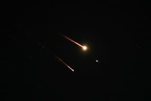 Anti-missile system fires interception missiles as drones and missiles fired from Iran.
