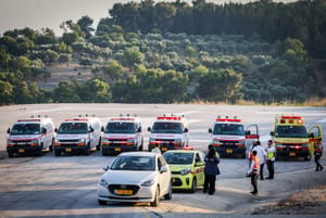 Medical teams waiting for the arrival of injured people from the scene of a drone attack 