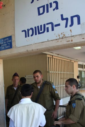 Ultra-Orthodox Jewish men arrive at the Bakum Reception and Sorting base in Tel Hashomer
