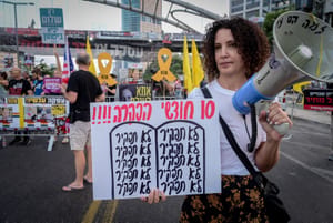 Demonstrators protest for the release of Israelis held hostage in the Gaza Strip, outside Hakirya Base