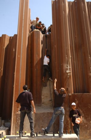 Palestinian boy from Rafah climbs down into the Philadelphi Corridor