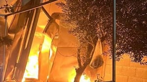 Settlers set building alight