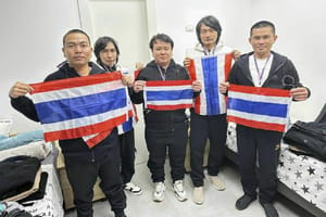Thai hostages who were freed from Hamas captivity, from left to right, Surasak Lumnau, Sathian Suwannakham, Bannawat Saethao, Watchara Sriaoun and Pongsak Thaenna, hold the Thailand flag
