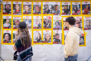 Passing pictures of hostages.