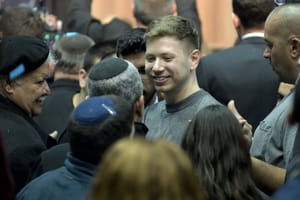 Yair Netanyahu, the son Israeli Prime Minister Benjamin Netanyahu, with supporters after the release of exit polls results of the Israeli general election, at the Likud party's headquarters in Tel Aviv, 2020