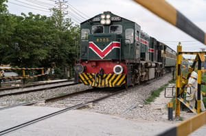 Pakistan train approaches railway crossing 