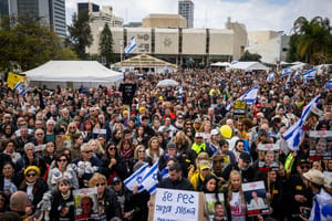 Israelis watch the release of hostages from Hamas captivity as part of a deal between Israel and Hamas, at Hostage square in Tel Aviv, February 22, 2025.