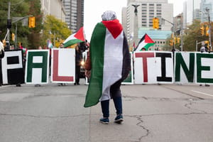 Pprotesters hold letters that spell Palestine at a protest for Palestinians against the War in Gaza in Toronto, Canada