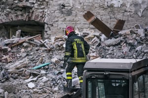 Rescue team member working through the rubble following the earthquake