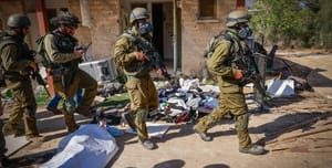 IDF soldiers passing by the dead.