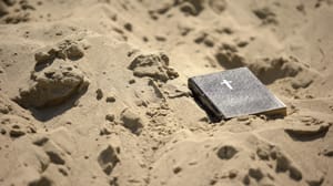 A bible in the sand.