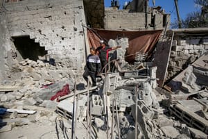 Palestinians at the site of an Israeli airstrike at the Al-Jurn neighborhood, in Gaza City, on May 23, 2025.