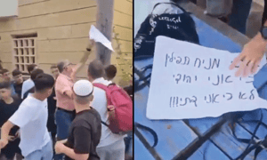 Teacher ripping off a sign saying "I lay tefillin because I'm a Jew, not becasue I'm religious"