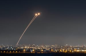 Anti-missile system fires interception missiles as missiles fired from Iran as it seen over central Israel, June 19, 2025.