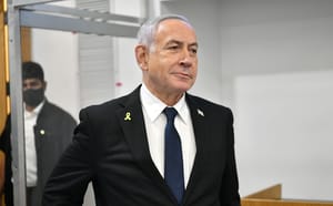 Israeli Prime Minister Benjamin Netanyahu arrives to the courtroom at the Distrcit court in Tel Aviv, before the start of his testimony in the trial against him, July 14, 2025.