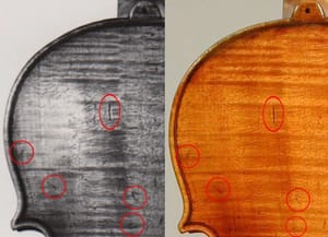 Photo identifying the stolen violin by distinctive markings