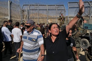 Druze residents protest near the Israeli-Syrian border fence in solidarity with their community in Syria, July 16, 2025. 