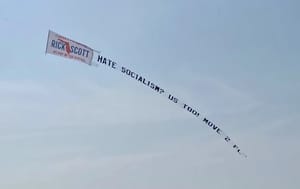 Rick Scott's banner over NYC