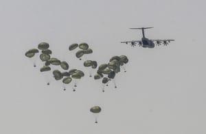 Airdropping aid.