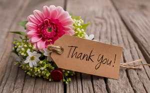 A thank you card with colourful flowers 