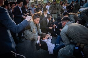 Ultra orthodox Jews clash with police during a protest against the drafting of ultra orthodox jews to the Israeli army, on road 4 near Bnei Brak, August 19, 2025. 