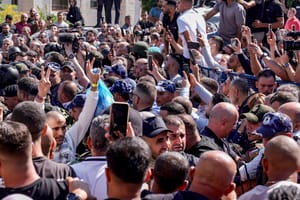 Palestinian prisoners who were released in a hostage deal between Israel and Hamas arrive in the city of Ramallah, October 13, 2025. 