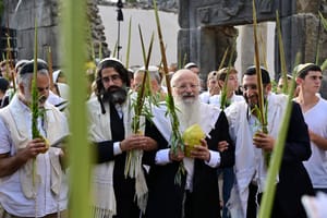 Rabbi Shmuel Eliyahu and his students hold the Four Species as they attend a morning prayer during the Jewish holiday of Sukkot, in Katzrin, northern Israel, on October 12, 2025.