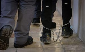Man in leg chains