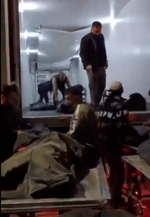 Truck transports body bags with murdered Iranians, Jan 2026