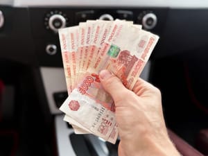 Man holding Russian currency