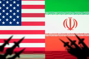 Flags of the United States and Iran with missile launchers in silhouette, portraying the rising conflict and danger of war between the two nations.