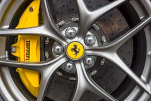 The wheel and brake system of a Ferrari sports car.