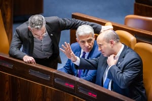 Israeli prime minister Naftali Bennett, Minister of Foreign Affairs Yair Lapid and MK Boaz Toporovsky during a discussion and a vote on a bill to dissolve the Knesset, at the assembly hall of the Israeli parliament, in Jerusalem, on June 22, 2022.