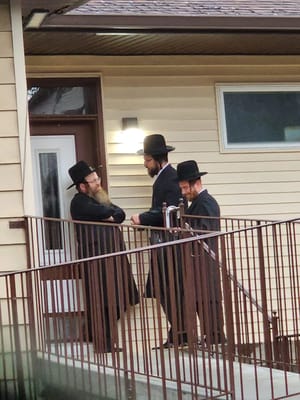 Rabbi Lipa Friedman outside the Admor's home