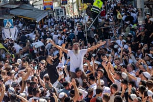 Jewish men in the street during Tikkun HaKlali near the tomb of Rabbi Nachman of Breslov in Uman, on eve of the Jewish holiday of Rosh Hashanah, September 22, 2025.
