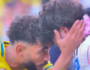 Brazil's Matheus Cunha comforted Japan's Ao Tanaka