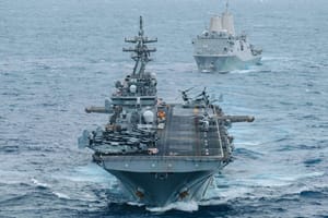 USS Boxer (LHD 4) and USS Portland (LPD 27) sail in formation while transiting the Indian Ocean,