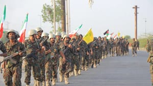Houthis holding Iranian and Hezbollah flags