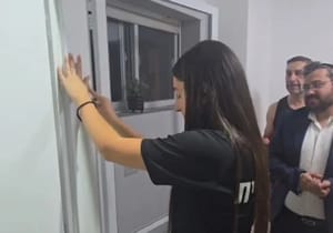 Freed Hostage Karina Ariev Puts Up Mezuzah