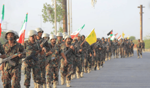Houthi soldiers holding Iranian and Hezbollah flags
