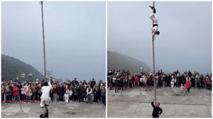 Acrobat Balancing A Stunt Man On a 6-Meter-Long Bamboo