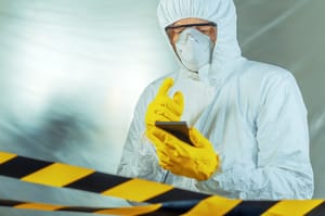 Epidemiologist using smartphone in hospital virus infection quarantine