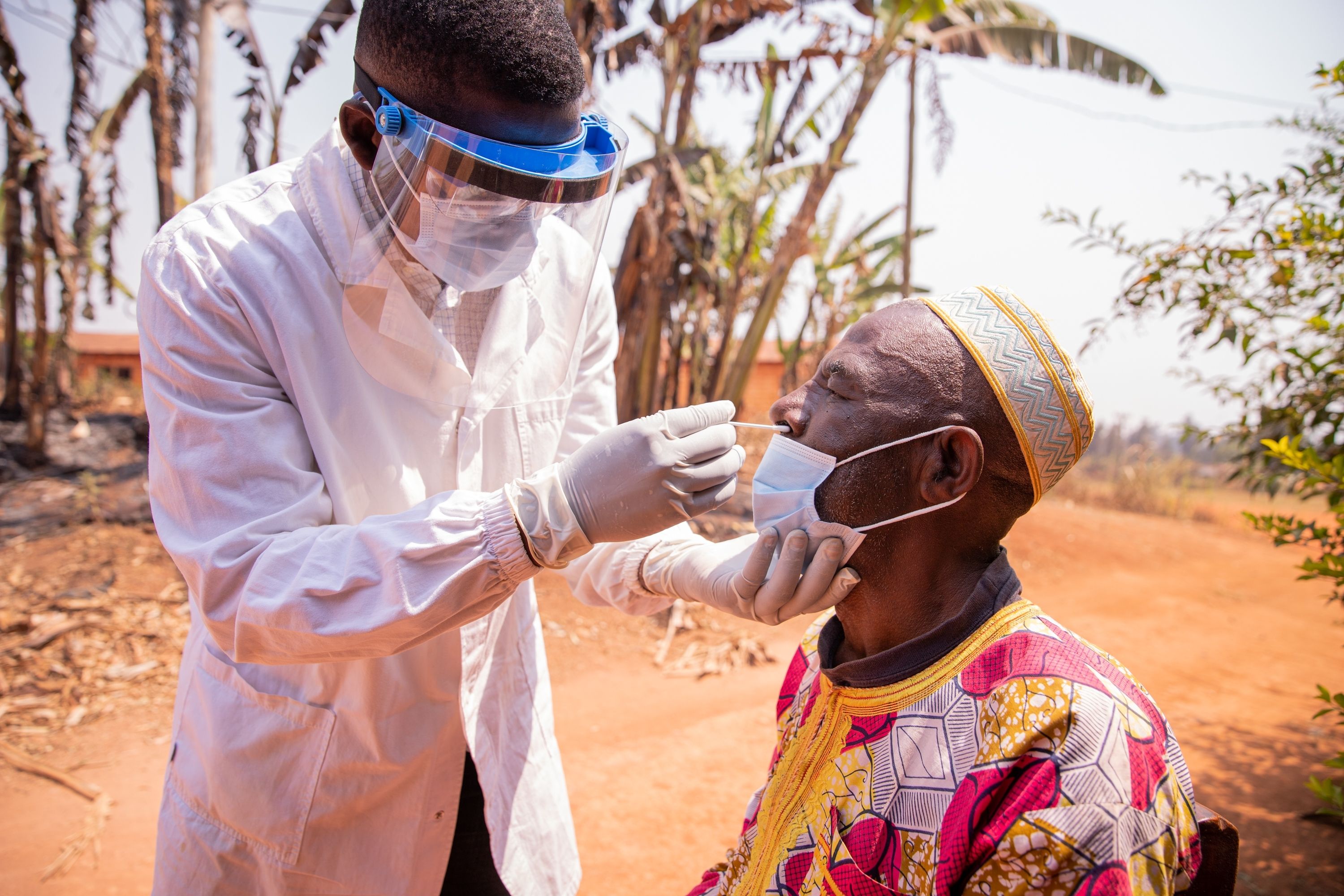 Doctor in Africa conducting swab test on suspected case