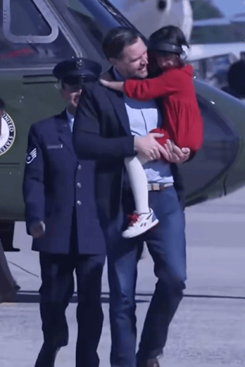 JD Vance carrying their four-year-old daughter, Mirabel