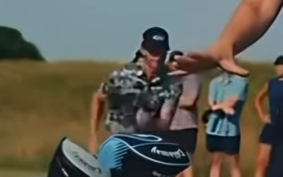 Advertisement Shows Man Pushing Female Golfer to Ground