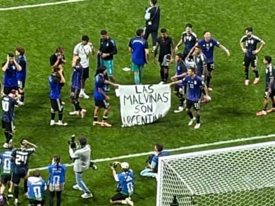 Argentina's national team with banner reading "Malvinas (Falkland Islands) are Argentine"