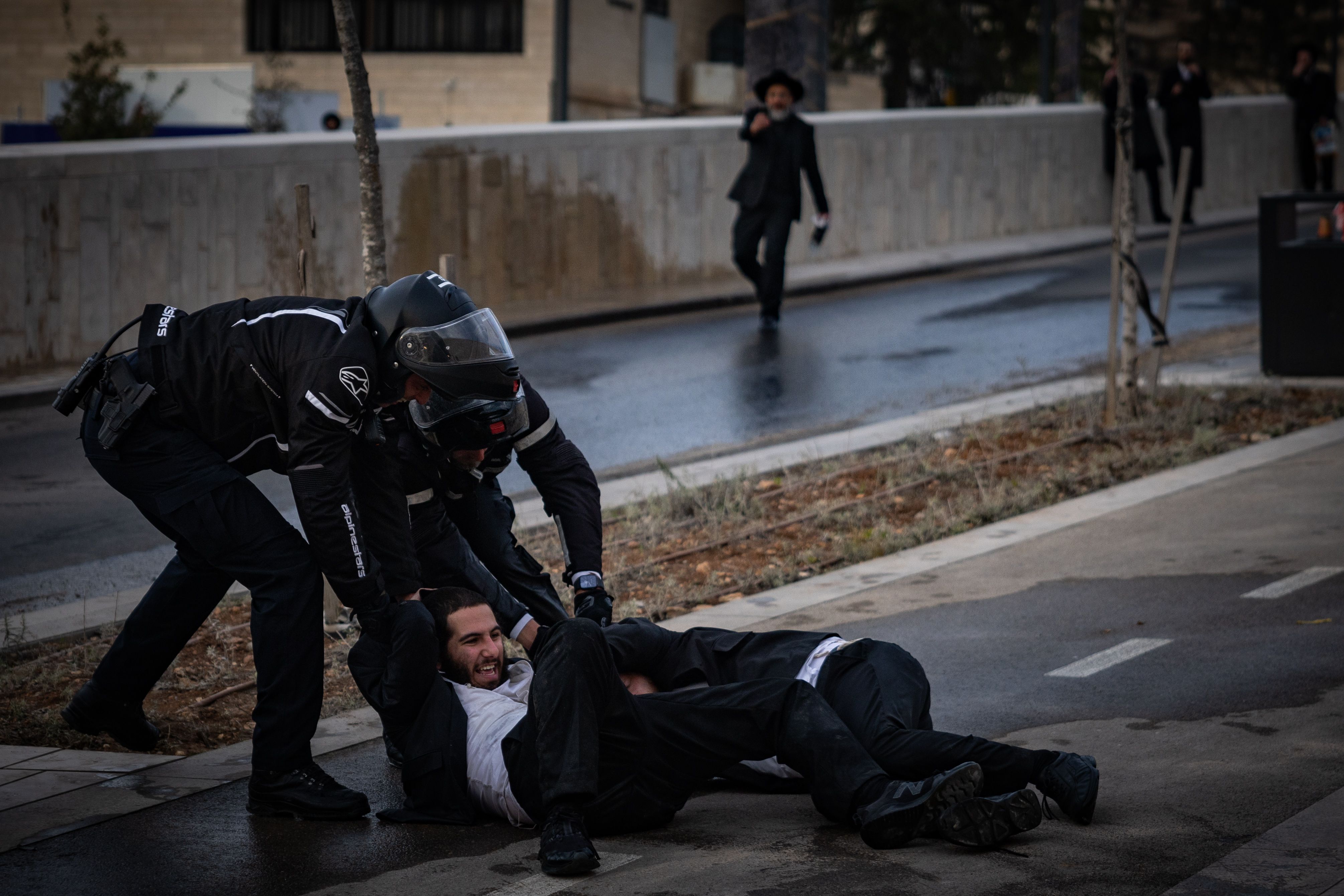 Ultra orthodox Jews protest and clash with police during a protest against the drafting of ultra orthodox jews to the Israeli army, outside a conference of ultra-Orthodox soldiers in Jerusalem, January 28, 2025.